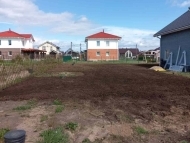 Отсыпка участка почво-растительным грунтом в КП Петровские Сады